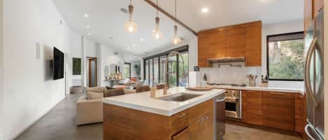 Fridge, dishwasher, coffee/tea maker, cookware/dishes/utensils