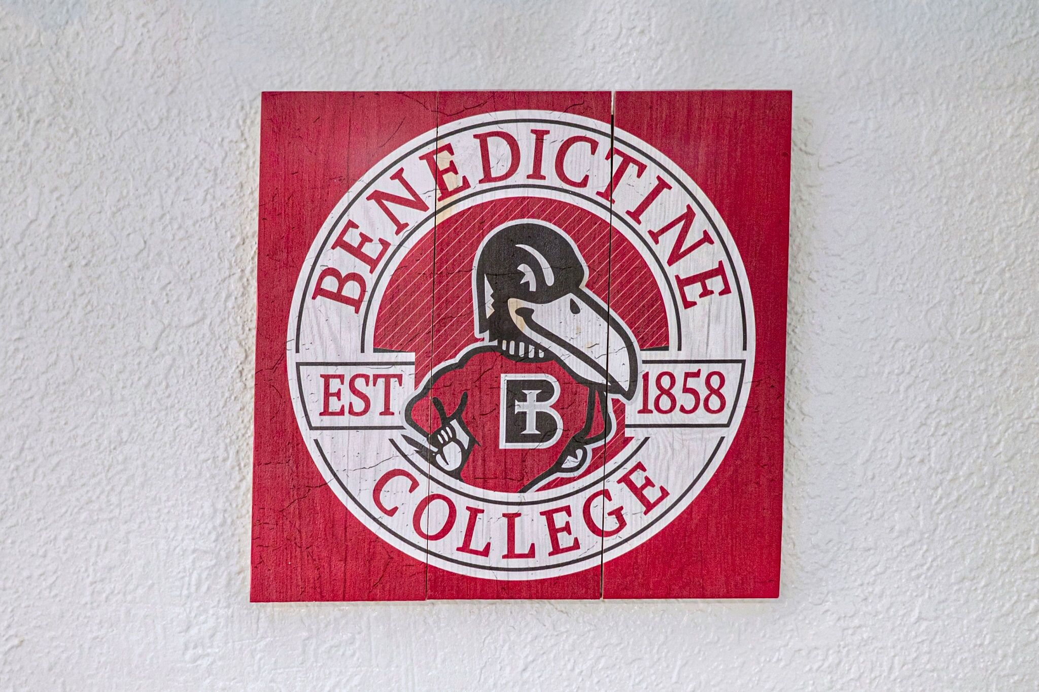 A logo with the text "Benedictine College" and the year "1858".