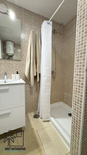 Hair dryer, towels, soap, shampoo