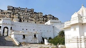 A historic fort with multiple levels and a large gate. - Tryambakam Villa (Bhilwara)