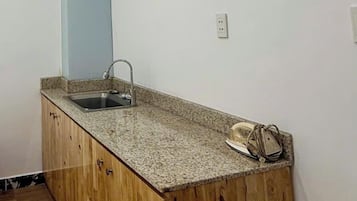 Cleaning supplies, paper towels, dining tables