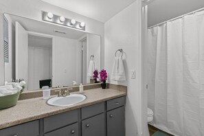 Shower, hair dryer, towels