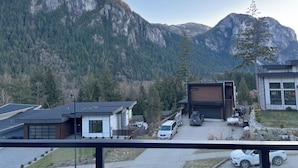 A residential area with modern houses, a garage, and a driveway.