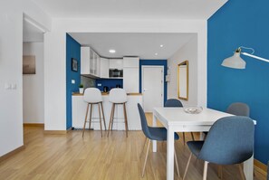 Cozy living space with a dining area, kitchenette, and separate room.