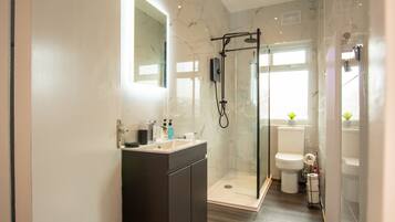 Shower, hair dryer, towels