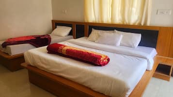 Deluxe Triple Room | Down duvets, memory-foam beds, individually furnished, bed sheets