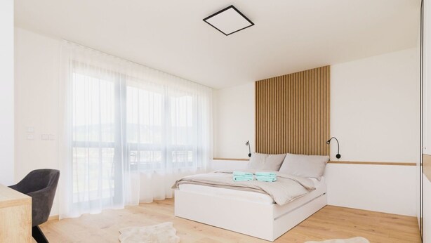 Une chambre à coucher avec un lit, une chaise et un bureau.