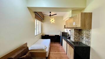 Superior Room | Living area | 32-inch Smart TV with cable channels
