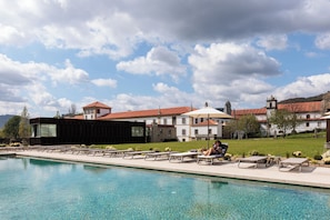 Indoor pool, seasonal outdoor pool, pool umbrellas, pool loungers