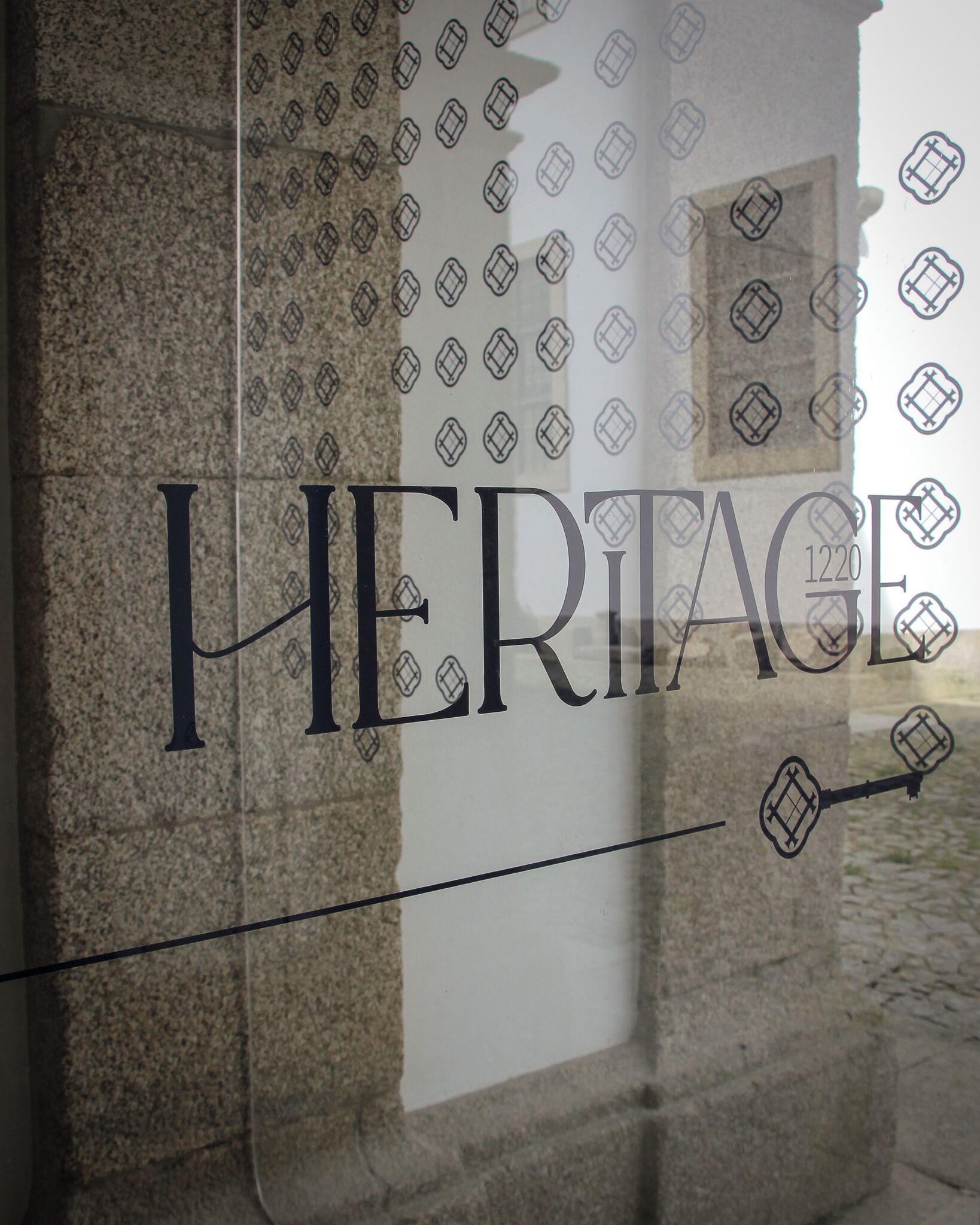 A sign with the word "HERITAGE" and the number "1220" on it.