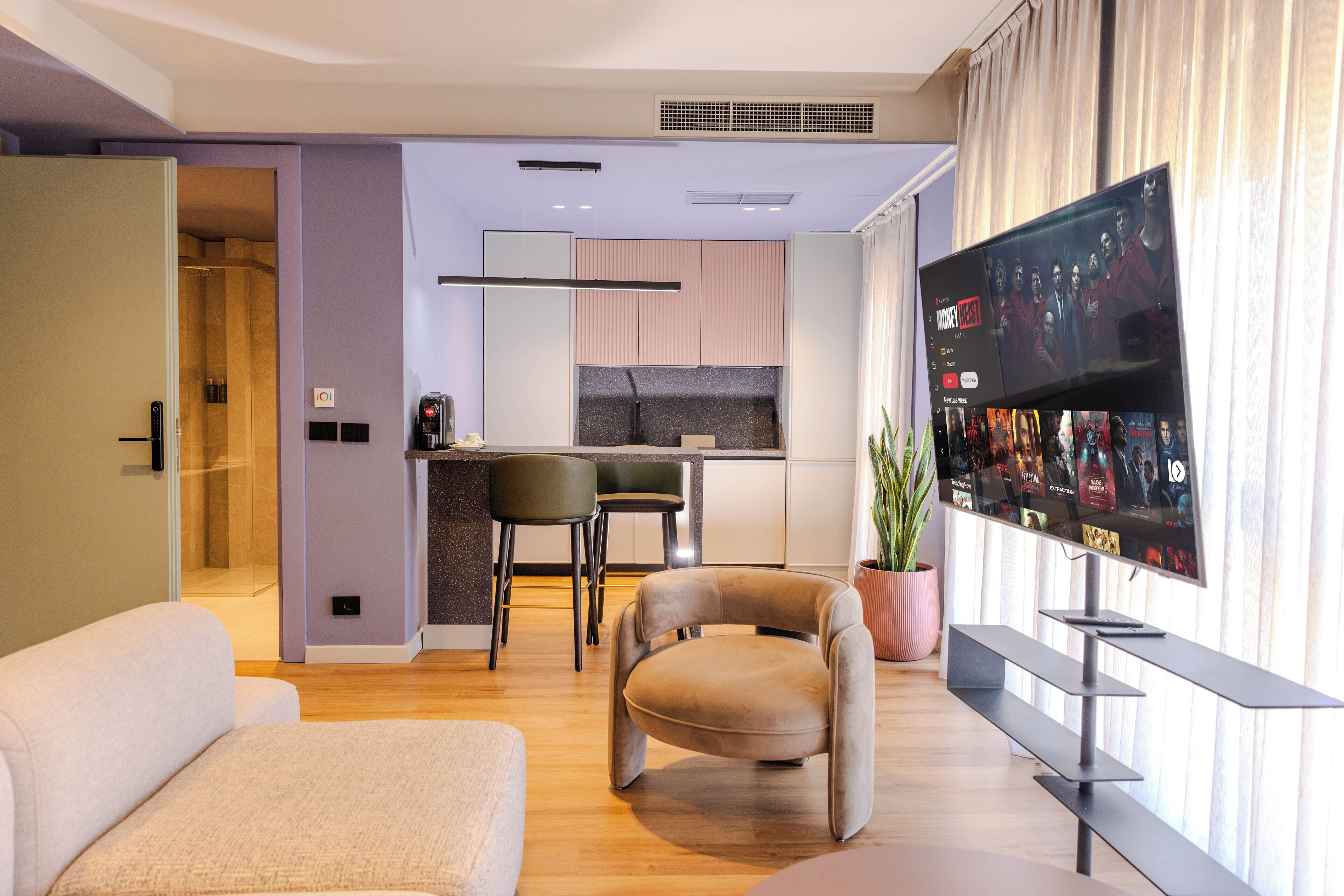 Superior Apartment | Living area | 50-inch plasma TV with cable channels