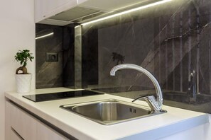 Fridge, stovetop, coffee/tea maker, cookware/dishes/utensils