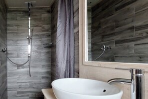 Shower, hair dryer, towels, toilet paper