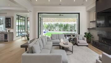 Luxury House, Multiple Beds, Pool Access, Pool View (Mandeville Canyon) | Living area | 65-inch flat-screen TV with digital channels, fireplace