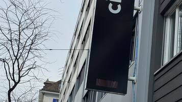 A building with a 'cit pop' sign, a 'Lyca Mobile' sign, and a 'Garage' sign.