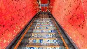 A staircase with colorful tiles leading upwards, surrounded by red walls. - Welcome to Black Palace-D! A beautiful downtown loft with easy access to everyth (Springfield)