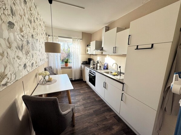 Fridge, microwave, stovetop, coffee/tea maker