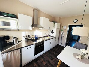 Fridge, microwave, stovetop, coffee/tea maker