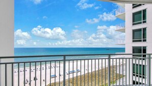 A balcony with a view of a beach and ocean. - ☀️Beachfront with Gorgeous Views-Aqua Resort 711☀️ (Panama City Beach)