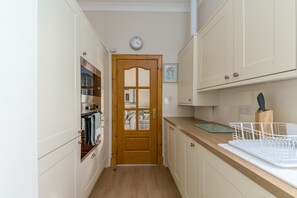 Fridge, microwave, oven, cookware/dishes/utensils