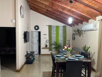 Charming gated 2-bedroom house with WiFi, AC, and spacious yard