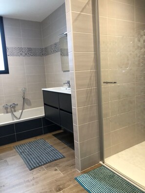 Shower, hair dryer, towels, soap