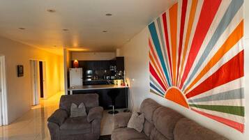 Apartment, 2 Bedrooms, Balcony, Partial Ocean View | Living area | Flat-screen TV
