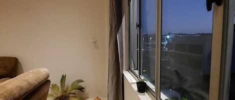 Apartment, 2 Bedrooms, Balcony, Partial Ocean View | Living area | Flat-screen TV