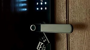 A door with a keypad lock and a keyhole. - Nma a Residences 2 (Riyadh)