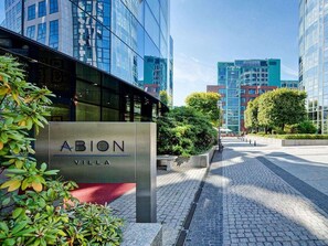 A modern building with a sign reading "ABION VILLA". - Abion Villa Suites (Berlin)