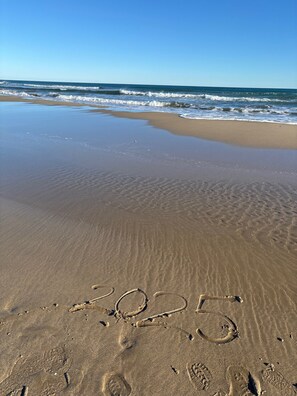 On the beach, sun-loungers