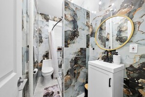 Shower, hair dryer, towels, soap