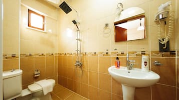 Shower, hair dryer, slippers, towels