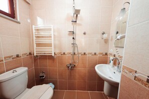 Shower, hair dryer, slippers, towels