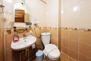 Shower, hair dryer, slippers, towels