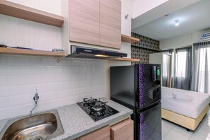 Standard Studio, 1 Bedroom (Apartment) | Private kitchen | Fridge, rice cooker - Fancy and Nice Studio Apartment at Podomoro Golf View (Gunung Putri)