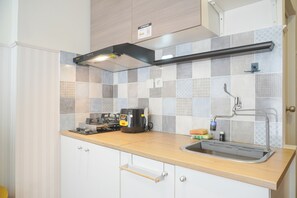 Standard Apartment, 1 Bedroom (Apartment) | Private kitchen | Fridge, rice cooker - 2BR with Comfortable Design at Podomoro Golf View Apartment (Gunung Putri)