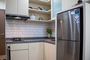 Private kitchen - Well Furnished 2BR at Podomoro Golf View Apartment (Gunung Putri)