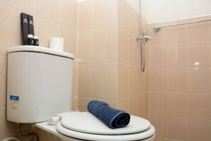 Standard Studio, 1 Bedroom (Apartment) | Bathroom | Shower, free toiletries, towels - Comfort Studio Apartment for 4 Pax at Podomoro Golf View (Gunung Putri)