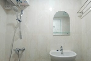 Standard Studio, 1 Bedroom (Apartment) | Bathroom | Shower, free toiletries, towels - Brand New and Homey Studio at Tamansari Skylounge Makassar Apartment (Makassar)