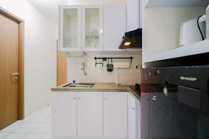 Standard Apartment, 1 Bedroom (Apartment) | Private kitchen | Fridge, rice cooker - Comfy 1BR with Extra Room Podomoro Golf View Apartment (Gunung Putri)