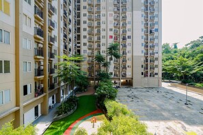 Exterior - Comfy 1BR with Extra Room Podomoro Golf View Apartment (Gunung Putri)