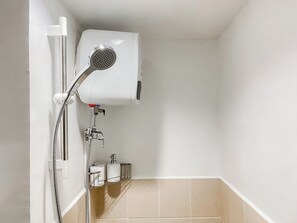 Standard Studio, 1 Bedroom (Apartment) | Bathroom | Shower, free toiletries, towels - Warm and Homey Studio at Podomoro Golf View Apartment (Gunung Putri)