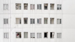 A multi-story building with numerous windows, some of which are open or have curtains. - Best Choice and Restful Studio at Pavilion Permata Apartment (Surabaya)