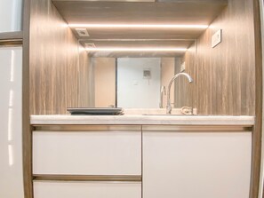 Standard Studio, 1 Bedroom (Apartment) | Private kitchen | Fridge - Cozy and Homey Studio at The Alton Apartment (Semarang)