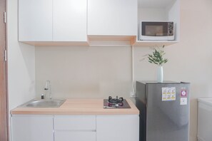 Standard Studio, 1 Bedroom (Apartment) | Private kitchen | Fridge - Homey Living and Well Designed Studio Room at Royal Sentul Park Apartment (Bogor)