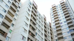 A high-rise residential building with multiple balconies and air conditioning units. - Comfortable and Simply 1BR Apartment Centro City (Jakarta)