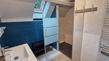 Shower, hair dryer, towels, toilet paper