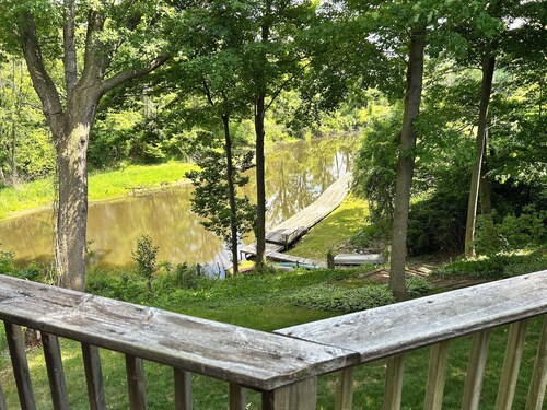 Riverbend Retreat Middle Branch Cottage
Fireplace and hot tub with river view.