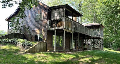 Riverbend Retreat Middle Branch Cottage
Fireplace and hot tub with river view.